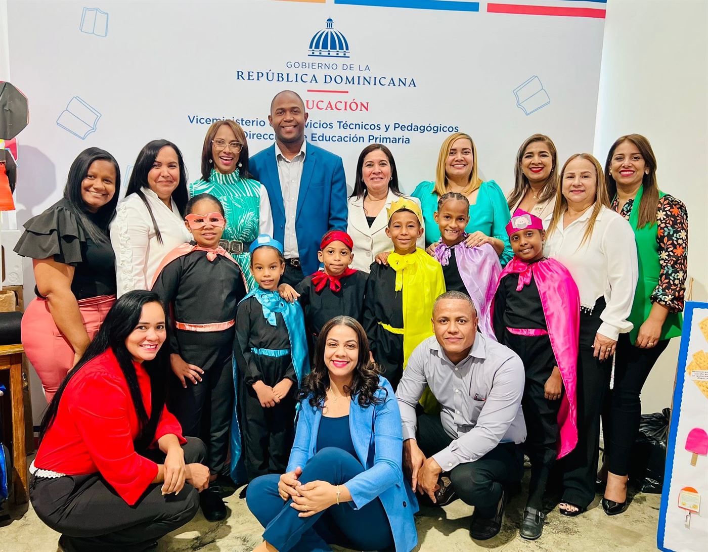 Students in superhero capes with their teachers at the 2025 National Reading Festival